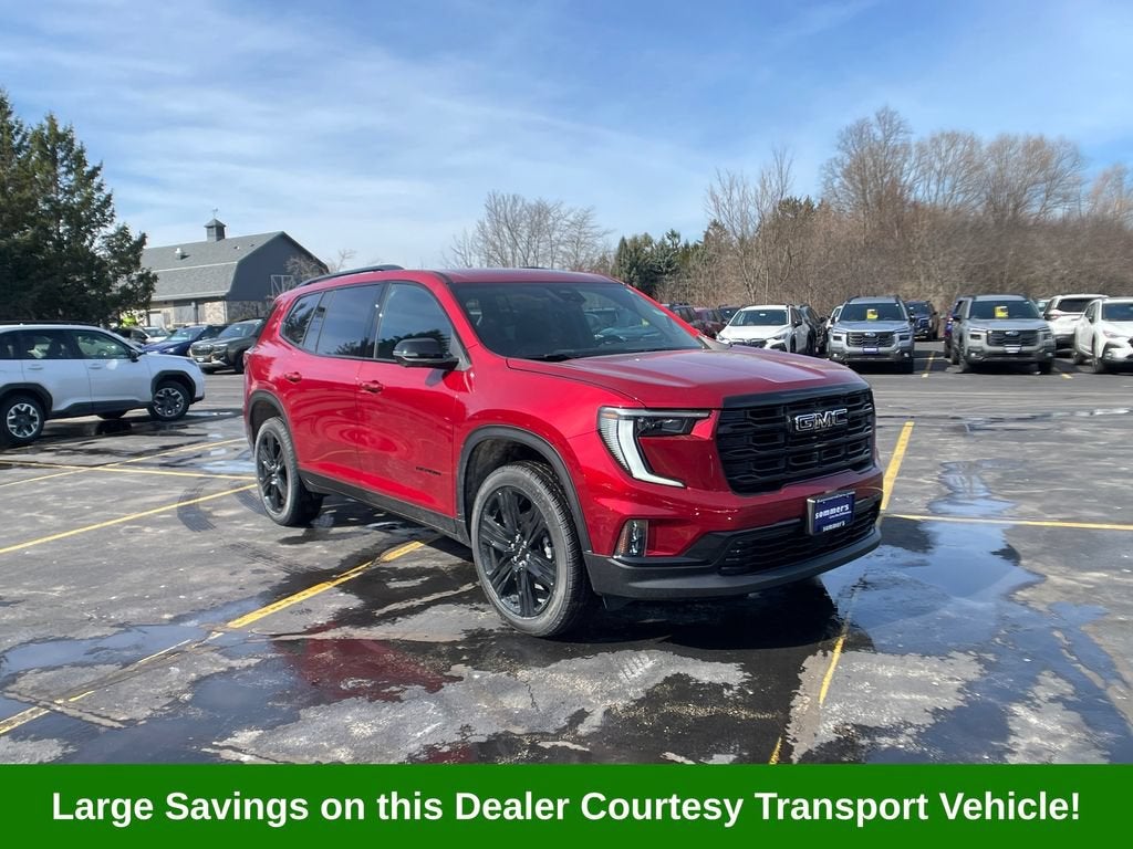 2026 GMC Acadia Elevation in Volcanic Red Tintcoat — front three-quarter view