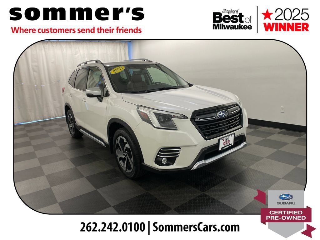 2023 Subaru Forester Touring in White — front three-quarter view